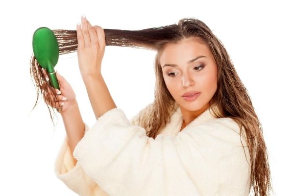 hair training - woman brushing wet hair